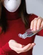 Woman applying hand sanitizer 3987151